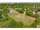 Aerial view showing expansive green space, community garden, and tennis courts amidst a residential area at 1 Marlow Dr, Charleston, SC 29403