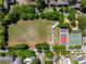 Bird's eye view of community green space including garden, sport courts, and a large field at 1 Marlow Dr, Charleston, SC 29403
