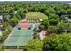 Aerial view of sports park featuring tennis, basketball courts, garden, field, and a playground area at 1 Marlow Dr, Charleston, SC 29403