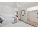 Bright bedroom with hardwood floors featuring two twin beds and an adjacent doorway to dining area at 1 Marlow Dr, Charleston, SC 29403