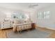 Bright bedroom featuring a unique bed frame, stylish decor, and natural light from the shuttered windows at 1 Marlow Dr, Charleston, SC 29403