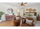 Bright bedroom with stylish decor, ceiling fan, cozy chairs, and a comfortable bed at 1 Marlow Dr, Charleston, SC 29403