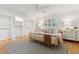 Well-lit bedroom showcasing closet space, a woven bed frame, and white walls with natural light at 1 Marlow Dr, Charleston, SC 29403