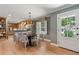 Inviting dining area featuring hardwood floors and modern light fixtures at 1 Marlow Dr, Charleston, SC 29403