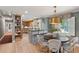 Well-lit dining area with hardwood floors and easy access to the kitchen, ideal for Gathering meals and gatherings at 1 Marlow Dr, Charleston, SC 29403