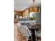 Elegant dining room showcasing designer lighting, hardwood floors, and seamless flow to the gourmet kitchen at 1 Marlow Dr, Charleston, SC 29403