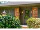 Close-up view of the front entrance with a brick exterior and decorative plants at 1 Marlow Dr, Charleston, SC 29403
