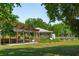 Community garden pavilion surrounded by flourishing greenery and raised garden beds at 1 Marlow Dr, Charleston, SC 29403