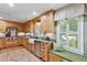 Charming kitchen featuring custom cabinets, granite countertops, stainless steel appliances, and a cozy window seat at 1 Marlow Dr, Charleston, SC 29403