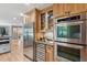 Gourmet kitchen featuring stainless steel appliances, custom cabinets, and a built-in wine fridge for the discerning homeowner at 1 Marlow Dr, Charleston, SC 29403