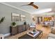 Light-filled living room flows into a dining area, featuring hardwood floors and stylish decor at 1 Marlow Dr, Charleston, SC 29403