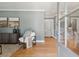 Stylish living area featuring hardwood floors, a modern cabinet, and views into the dining area at 1 Marlow Dr, Charleston, SC 29403