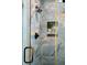 Shower with decorative blue tile, bronze fixtures, glass door and built in niche at 1 Marlow Dr, Charleston, SC 29403