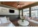 Cozy sunroom with stylish seating, a mounted TV, and an airy, relaxing atmosphere for all seasons at 1 Marlow Dr, Charleston, SC 29403