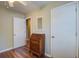 Well-lit bedroom with hardwood floors and featuring a classic writing desk and ample closet space at 1006 Ibis Ct, Mount Pleasant, SC 29464