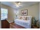 Cozy bedroom with hardwood floors, a daybed with decorative pillows, and a window that offers natural light at 1006 Ibis Ct, Mount Pleasant, SC 29464