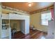 Bright bedroom with a loft bed, workstation, and charming decor details at 1006 Ibis Ct, Mount Pleasant, SC 29464