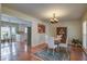 Elegant dining room with hardwood floors, a chandelier, and a view to other living spaces at 1006 Ibis Ct, Mount Pleasant, SC 29464