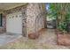 Charming brick home featuring an attached garage and an arched garden gate entrance at 1006 Ibis Ct, Mount Pleasant, SC 29464