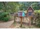 Charming community library boxes with wooden posts nestled in a green, wooded area at 1006 Ibis Ct, Mount Pleasant, SC 29464