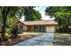 Beautiful brick home with attached garage, lush landscaping, and a welcoming entrance at 1006 Ibis Ct, Mount Pleasant, SC 29464