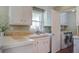 Bright kitchen area featuring ample counter space and a convenient laundry area at 1006 Ibis Ct, Mount Pleasant, SC 29464