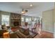 Cozy living room features a brick fireplace, hardwood floors, and an open layout at 1006 Ibis Ct, Mount Pleasant, SC 29464