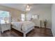 Bright main bedroom with hardwood floors, a ceiling fan, and ample natural light at 1006 Ibis Ct, Mount Pleasant, SC 29464