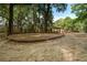 Outdoor playground featuring swings, picnic shelter, and climbing structure in a wooded area at 1006 Ibis Ct, Mount Pleasant, SC 29464