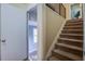 Carpeted staircase leading to upper level, with visible entryway and a room beyond at 1006 Ibis Ct, Mount Pleasant, SC 29464