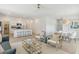 Bright living room showcasing an open floor plan with a modern kitchen and dining area at 1015 Swamp Rose Run, Summerville, SC 29485