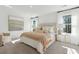Serene primary bedroom featuring neutral tones, plush bedding, and natural light at 1015 Swamp Rose Run, Summerville, SC 29485