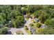 Aerial view of a home surrounded by lush greenery and mature trees in a peaceful neighborhood at 1016 Cider Ct, Summerville, SC 29483