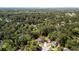 High-angle aerial view of a neighborhood dotted with houses nestled among lush green trees at 1016 Cider Ct, Summerville, SC 29483