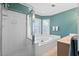 Bathroom with a glass-enclosed shower and soaking tub at 1016 Cider Ct, Summerville, SC 29483