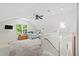 Bright and airy bedroom with a large window, ceiling fan, and neutral colored carpet at 1016 Cider Ct, Summerville, SC 29483