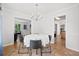 Bright dining room features hardwood floors and a charming chandelier at 1016 Cider Ct, Summerville, SC 29483