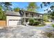 Two-story home with a two-car garage and charming double porches on a wide driveway at 1016 Cider Ct, Summerville, SC 29483