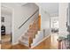 Inviting foyer with hardwood floors, a carpeted staircase, and access to other living areas at 1016 Cider Ct, Summerville, SC 29483