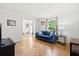 Comfortable living room with bright windows and wood floors at 1016 Cider Ct, Summerville, SC 29483
