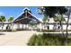 Welcoming entrance to the clubhouse with a modern architectural design and lush landscaping at 1017 Swamp Rose Run, Summerville, SC 29485