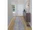 Inviting entryway featuring a console table, stylish mirror, and hardwood flooring at 1017 Swamp Rose Run, Summerville, SC 29485