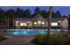 Inviting poolside bar with ambient lighting, televisions, and access to a refreshing pool at 1017 Swamp Rose Run, Summerville, SC 29485