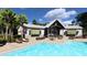 Charming poolside bar with outdoor seating, TVs, and convenient access to the refreshing pool at 1017 Swamp Rose Run, Summerville, SC 29485