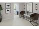 Relaxing sitting area with comfortable chairs, artwork, and a view into the bedroom at 1017 Swamp Rose Run, Summerville, SC 29485