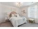 Bright bedroom with chevron wallpaper, rattan headboard, and coordinated decor at 1021 Swamp Rose Run, Summerville, SC 29485