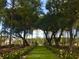 Beautiful walking path with manicured lawns lined with trees, perfect for an afternoon stroll at 1021 Swamp Rose Run, Summerville, SC 29485