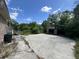 Backyard featuring a detached garage, and an overgrown yard at 1022 Miles Jamison Rd, Summerville, SC 29485