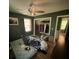 Bedroom featuring a closet, dark green walls, and hardwood flooring; needs cleaning and repair at 1022 Miles Jamison Rd, Summerville, SC 29485