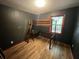 Bedroom with a wooden loft bed and dark gray walls at 1022 Miles Jamison Rd, Summerville, SC 29485